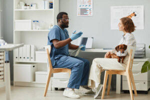 Vet giving educational advice to pet owner